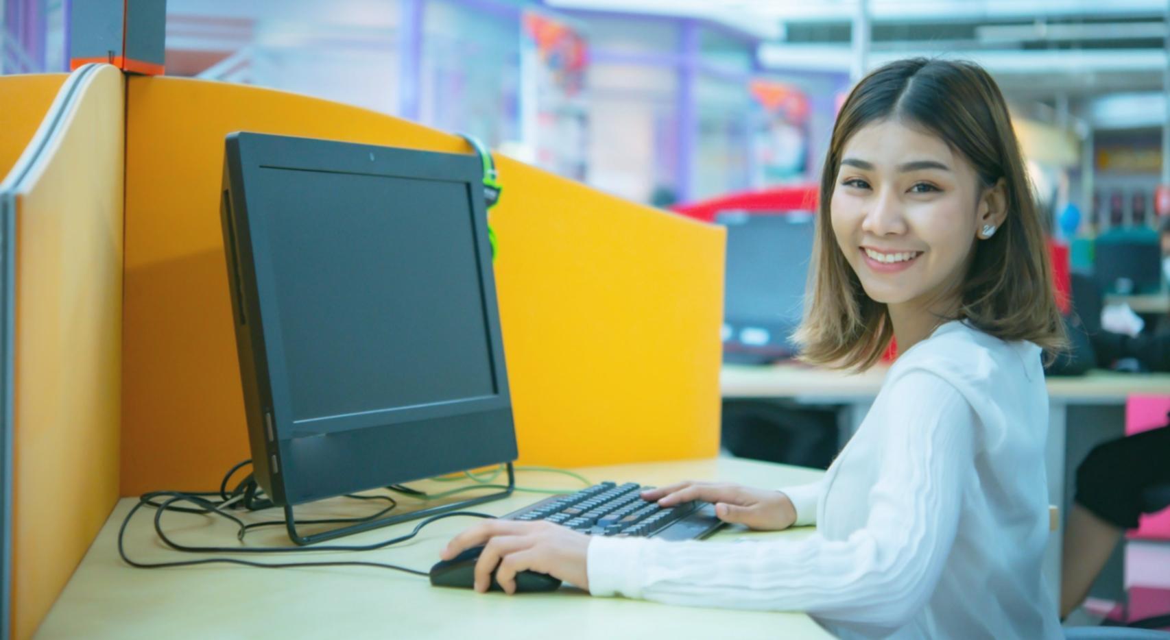 Workshop participant analyzing website structure on laptop